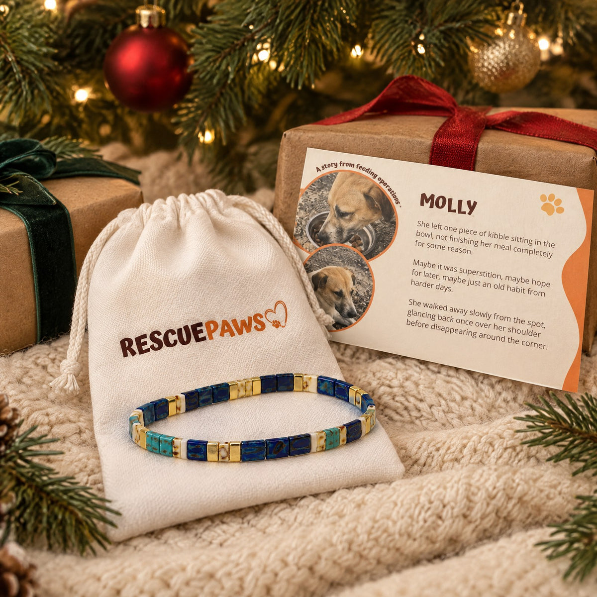 A Rescue Paws gift under the Christmas tree: Tile Beads bracelet, white pouch and dog story card