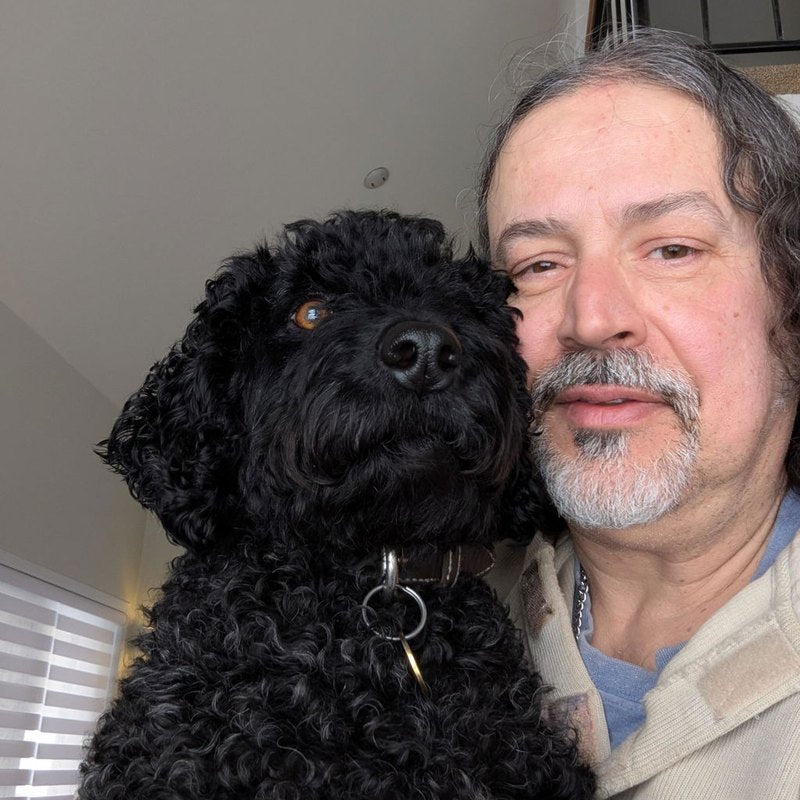A customer and his dog, photo shared in a review