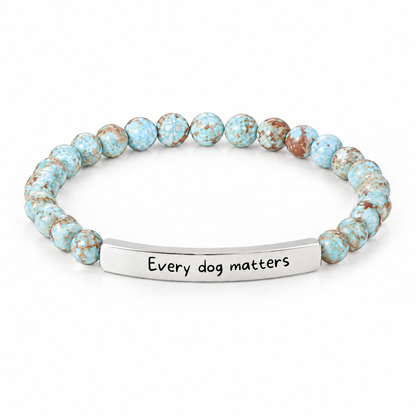 Every Dog Matters Bracelet (Lagoon): light aqua blue beads with a silver-tone bar that reads "Every dog matters"