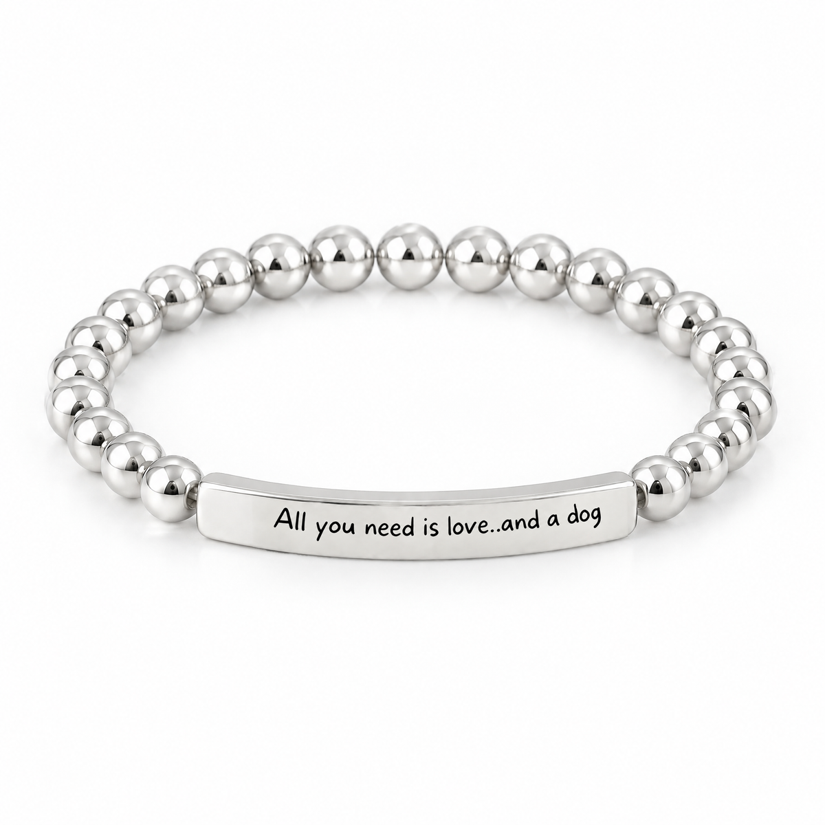 All You Need Is Love and a Dog Bracelet (Silver-Tone): polished silver-tone beads with a silver-tone bar that reads "All you need is love..and a dog"
