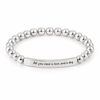 All You Need Is Love and a Dog Bracelet (Silver-Tone): polished silver-tone beads with a silver-tone bar that reads "All you need is love..and a dog"