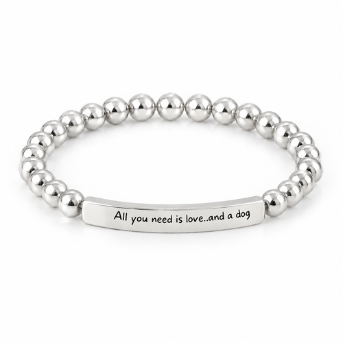 All You Need Is Love and a Dog Bracelet (Silver-Tone): polished silver-tone beads with a silver-tone bar that reads "All you need is love..and a dog"