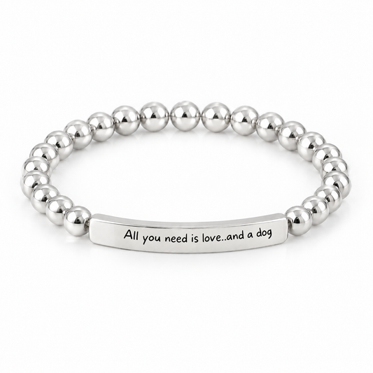 All You Need Is Love and a Dog Bracelet (Silver-Tone): polished silver-tone beads with a silver-tone bar that reads "All you need is love..and a dog"