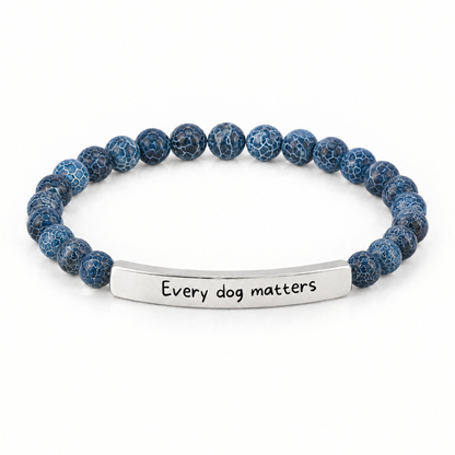 Every Dog Matters Bracelet (Ocean): deep blue crackle beads with a silver-tone bar that reads "Every dog matters"