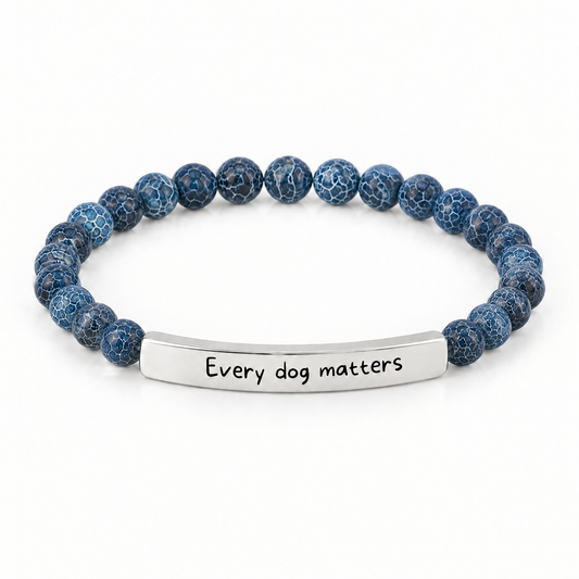 Every Dog Matters Bracelet (Ocean): deep blue crackle beads with a silver-tone bar that reads "Every dog matters"