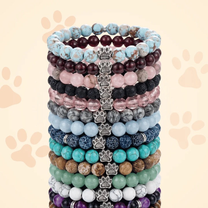 A tall stack of colorful Rescue Paws bracelets